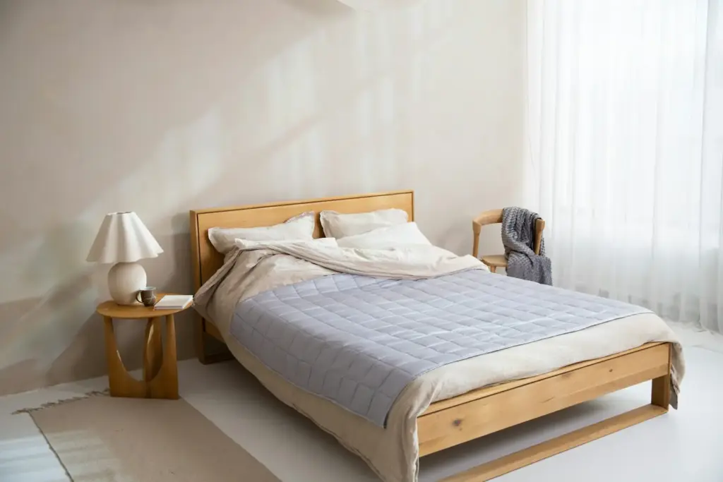Mattress on a bed in a bedroom with natural light