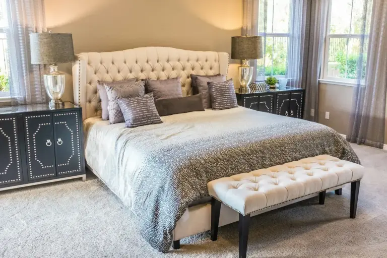 Bed with an upholstered tufted headboard